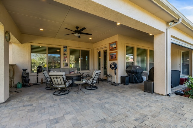 view of patio with grilling area and ceiling fan