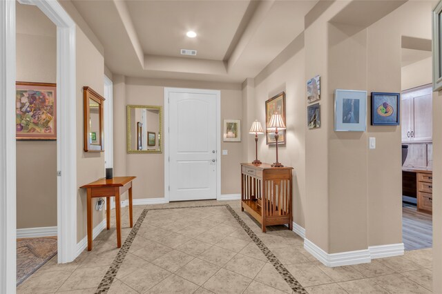 tiled living room with a tile fireplace, crown molding, and ceiling fan