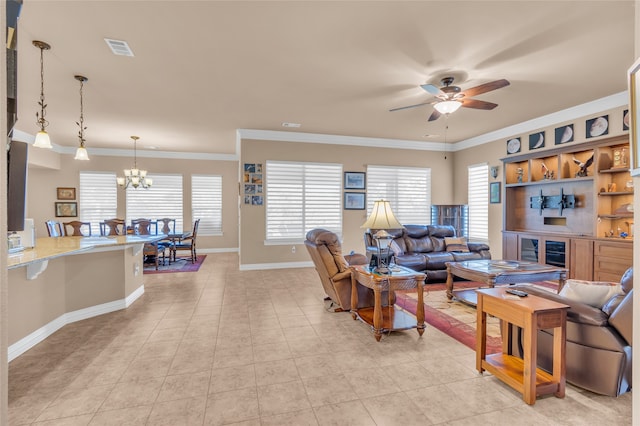 tiled living room featuring a healthy amount of sunlight, ornamental molding, and a fireplace