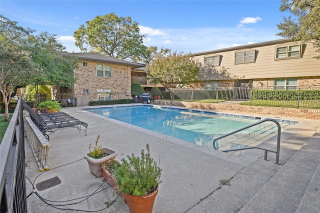 view of swimming pool with a patio area