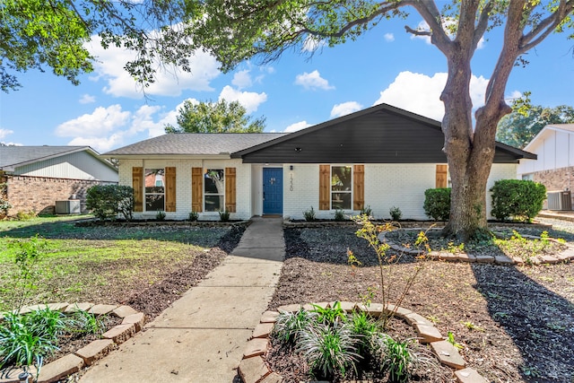 ranch-style house with a front lawn and central AC