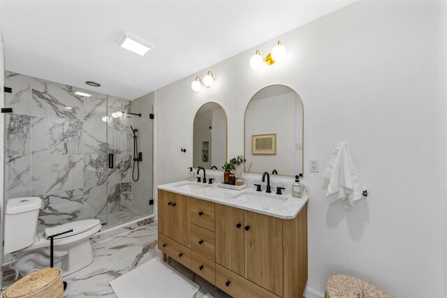 bathroom featuring toilet, an enclosed shower, and vanity