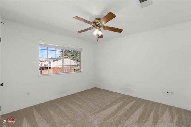 empty room featuring carpet and ceiling fan