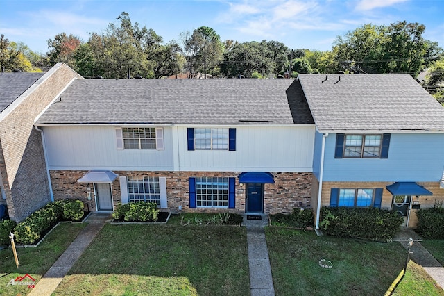 view of property featuring a front yard