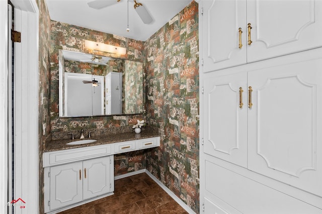 bathroom featuring tile patterned flooring and vanity