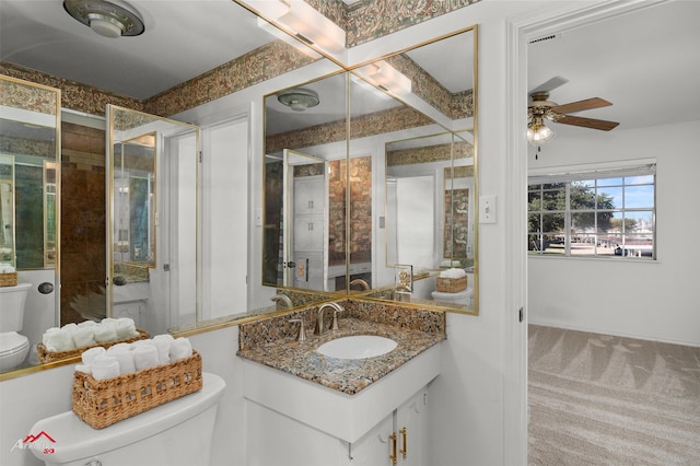 bathroom featuring beam ceiling, vanity, toilet, and ceiling fan