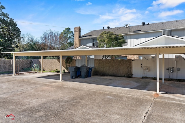 view of vehicle parking with a carport