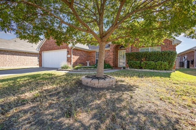 view of front of property featuring a garage and a front yard