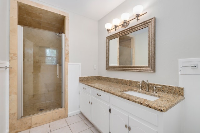 bathroom with vanity, tile patterned floors, and walk in shower