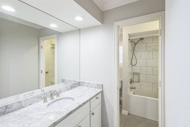 full bathroom with vanity, toilet, tiled shower / bath combo, and crown molding