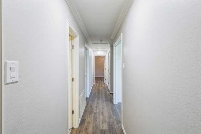 hall with crown molding and hardwood / wood-style floors