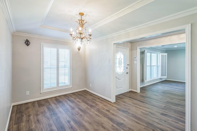 entryway with a notable chandelier, a healthy amount of sunlight, and dark hardwood / wood-style flooring