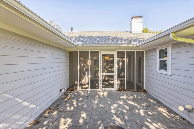 view of patio / terrace with a sunroom