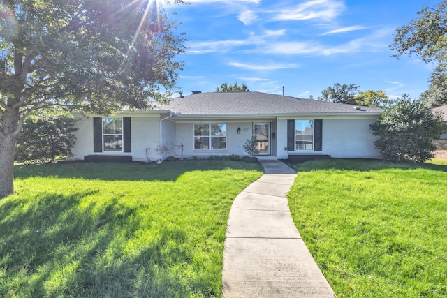 single story home with a front yard