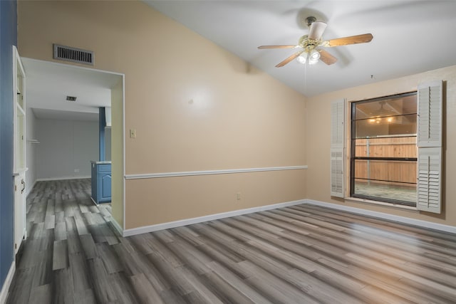 spare room featuring hardwood / wood-style floors, ceiling fan, and high vaulted ceiling