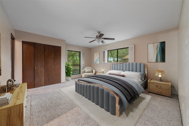 bedroom with light colored carpet and ceiling fan