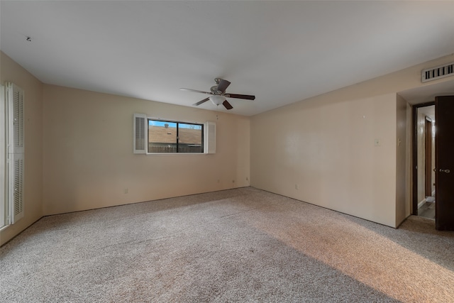 carpeted empty room with ceiling fan