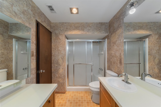 bathroom with vanity, toilet, and walk in shower