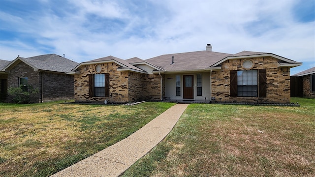 ranch-style house featuring a front lawn