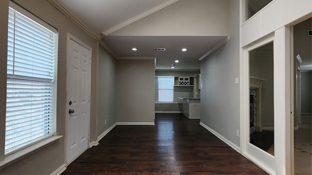 foyer entrance featuring crown molding and dark hardwood / wood-style flooring