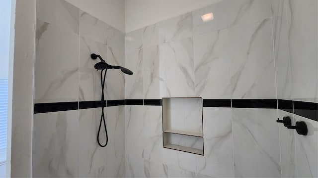 interior details with a tile shower