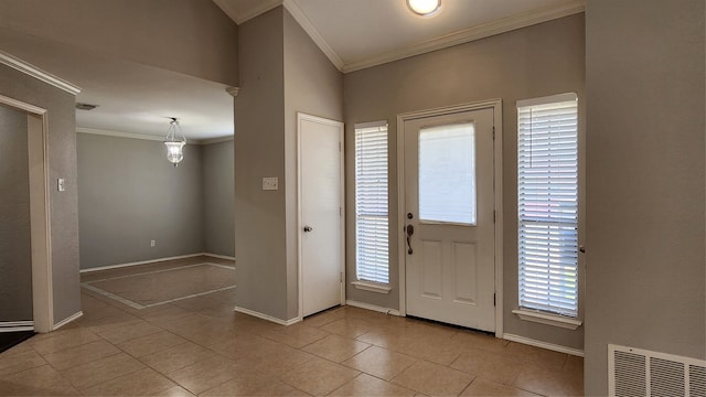 tiled entrance foyer with crown molding