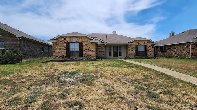 single story home featuring a front lawn