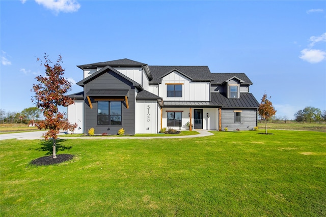 modern inspired farmhouse with a front yard