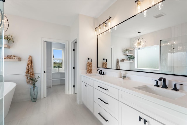 bathroom featuring separate shower and tub and vanity