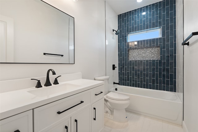 full bathroom with toilet, vanity, tile patterned floors, and tiled shower / bath