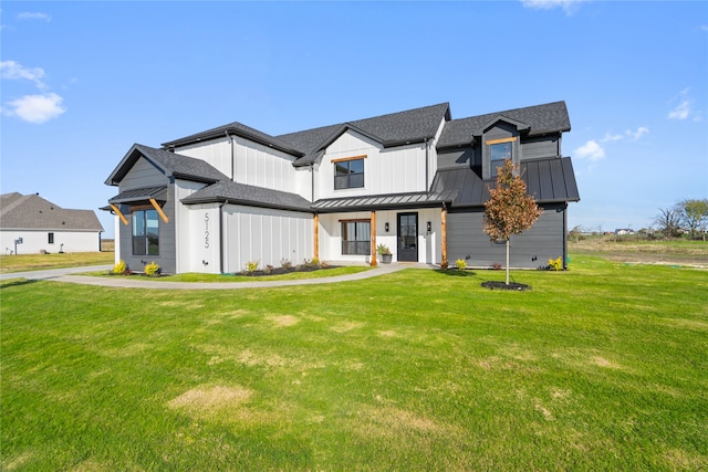 modern farmhouse featuring a front lawn