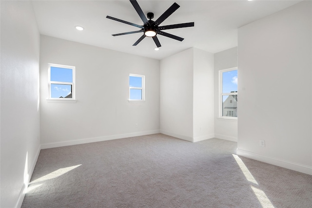 carpeted empty room with ceiling fan