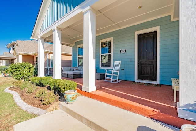 view of exterior entry featuring a porch