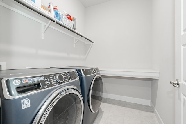 laundry room with separate washer and dryer