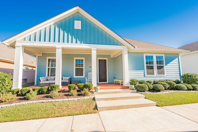 view of front of house with covered porch and outdoor lounge area