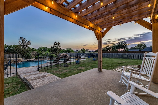 patio terrace at dusk featuring a lawn, a fenced in pool, and a pergola