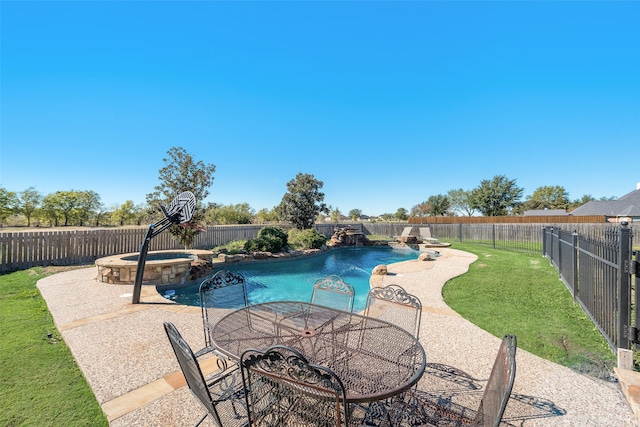 view of pool with pool water feature, a patio, an in ground hot tub, and a lawn