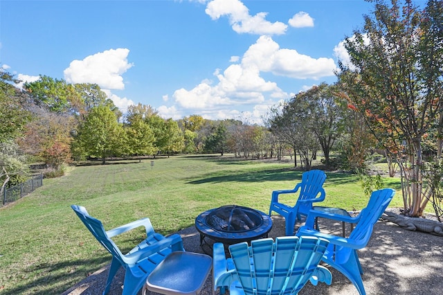 view of yard with a fire pit