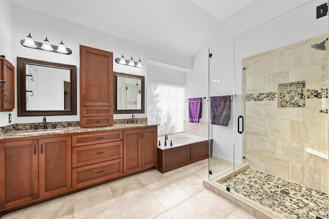 bathroom with separate shower and tub, vanity, vaulted ceiling, and tile patterned floors