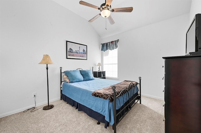 bedroom with vaulted ceiling, light colored carpet, and ceiling fan