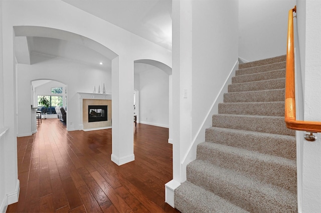 stairway with hardwood / wood-style flooring