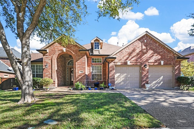 front facade featuring a front lawn and a garage