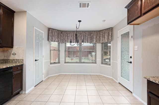 kitchen with dark brown cabinetry, light stone countertops, dishwasher, and hanging light fixtures