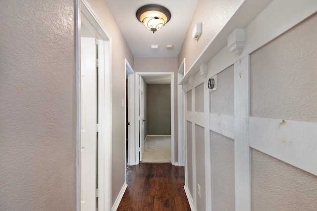 corridor featuring dark wood-type flooring