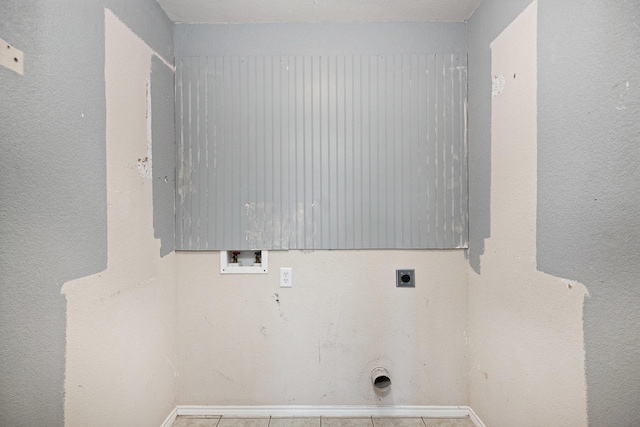 clothes washing area featuring hookup for an electric dryer, hookup for a washing machine, and light tile patterned floors