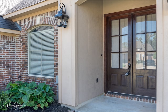 property entrance featuring french doors