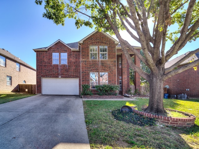 view of front of home featuring a garage and a front lawn