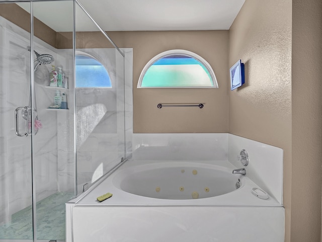 bathroom with separate shower and tub