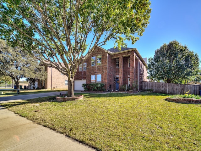 view of front facade with a front lawn and a garage