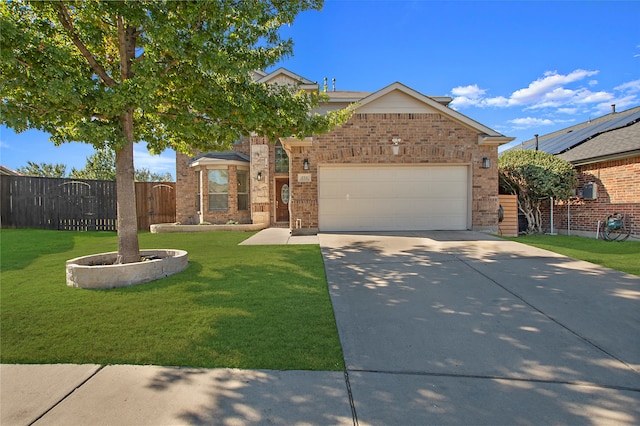 view of front of house with a front yard and a garage